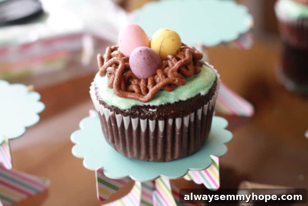 Cute Bird's Nest Easter Cupcakes. Easy to make and fun to eat, with chocolate Easter eggs to set them off. Finished bird's nest Easter cupcakes with chocolate eggs nestled inside the chocolate frosting nests.