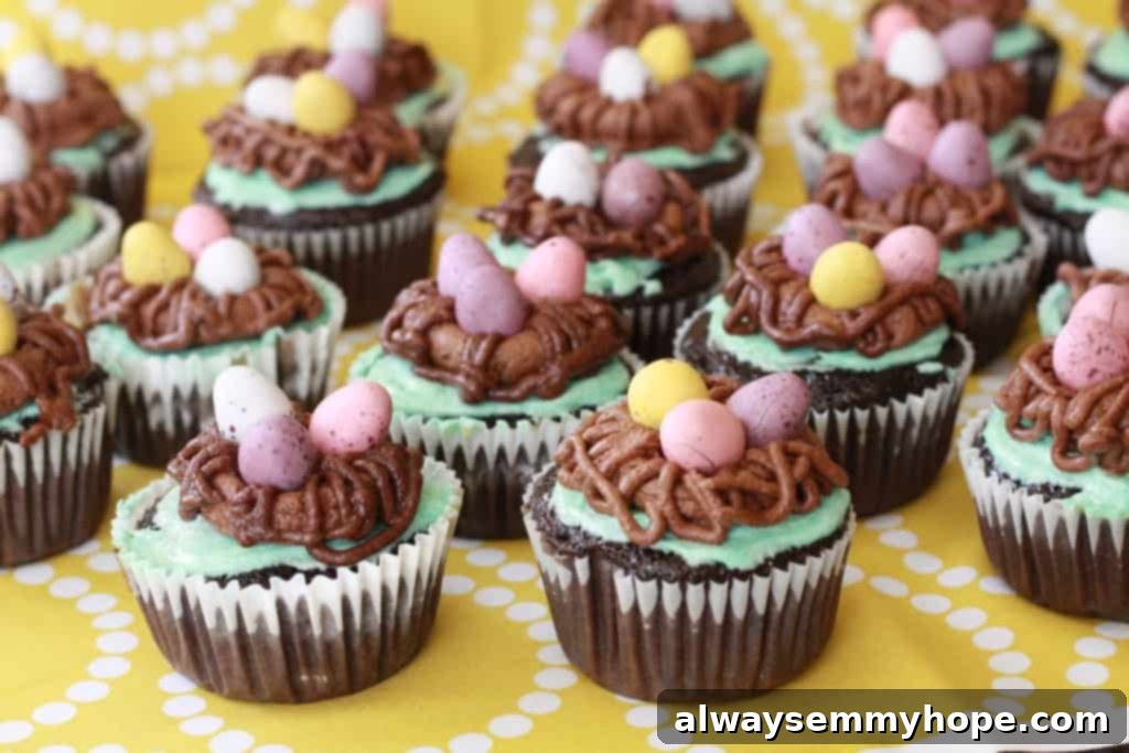 Cute Bird's Nest Easter Cupcakes. Easy to make and fun to eat, with chocolate Easter eggs to set them off. Rows of beautifully decorated bird's nest Easter cupcakes, ready for a spring celebration.