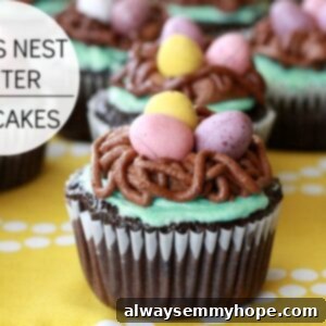 Charming Bird's Nest Easter Cupcakes 2 Rows of frosted cupcakes on a yellow tablecloth.