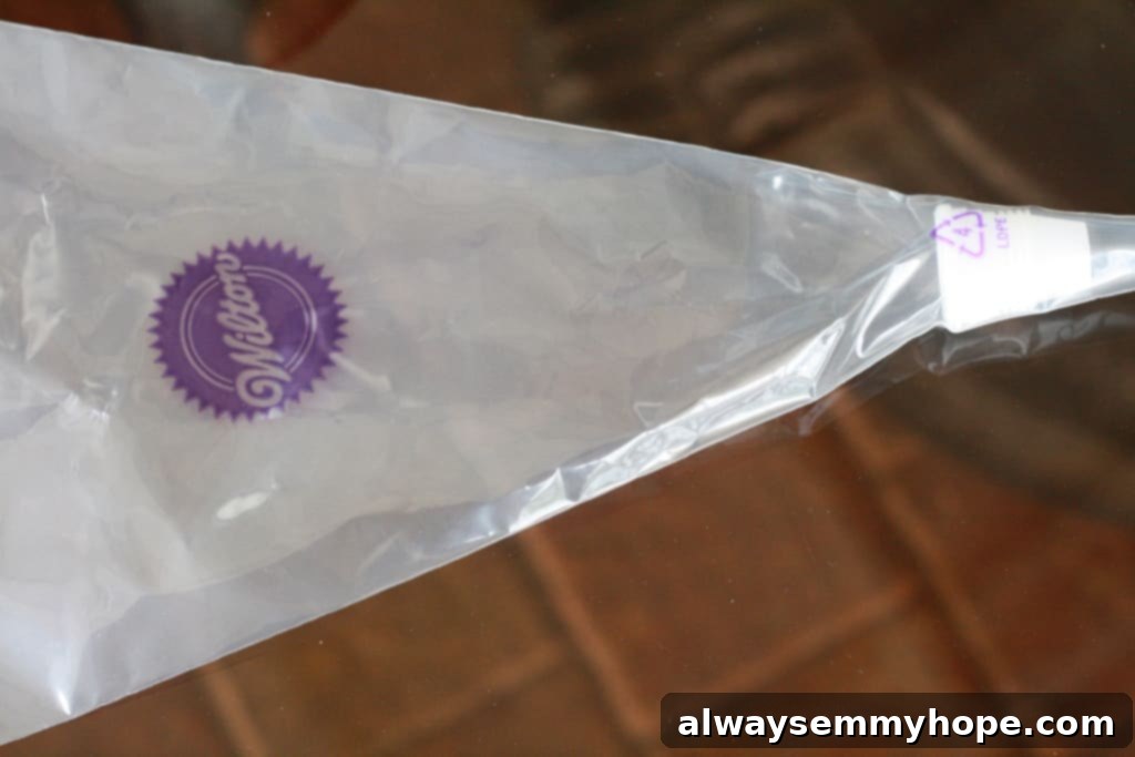 Cute Bird's Nest Easter Cupcakes. Easy to make and fun to eat, with chocolate Easter eggs to set them off; Overhead shot of a piping bag being prepared with a coupler.