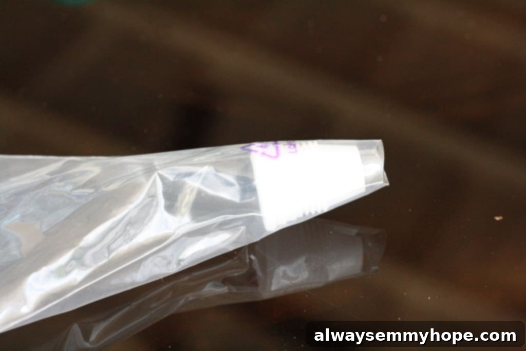 Cute Bird's Nest Easter Cupcakes. Easy to make and fun to eat, with chocolate Easter eggs to set them off. Close up of a piping tip ready to be attached to a piping bag for decorating.