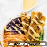 Top-down view of a delicious vegan crispy Cajun fried tofu salad drizzled with maple mustard dressing.