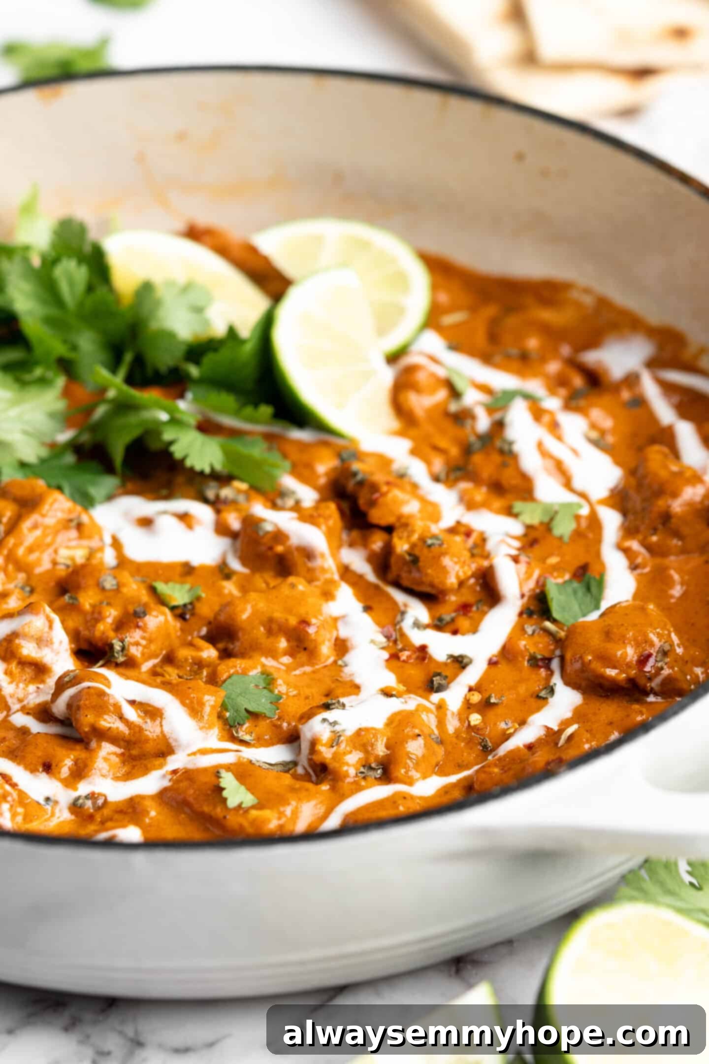 Vegan butter chicken in a large skillet, ready to be served, highlighting the vibrant colors and appealing texture