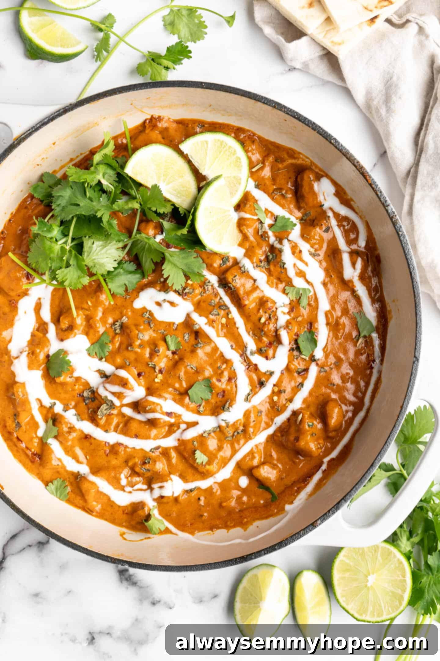 Vegan butter chicken served in a Dutch oven, garnished with fresh herbs, ready to be dished out