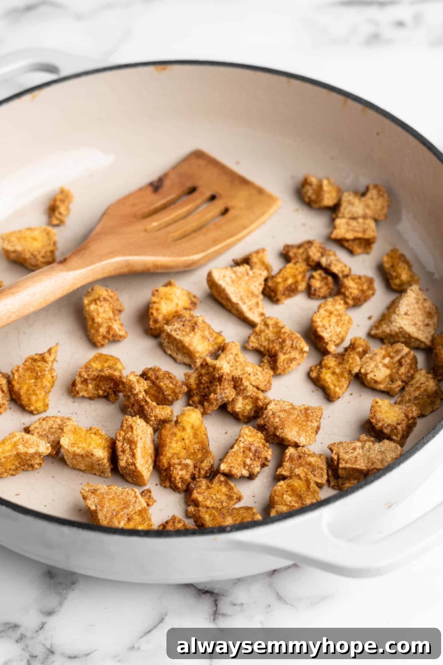 Close-up of perfectly pressed, cubed tofu, ready for seasoning and cooking