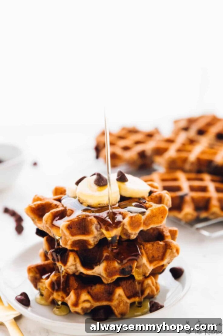 Delicious banana bread waffles studded with chocolate chips, served warm.