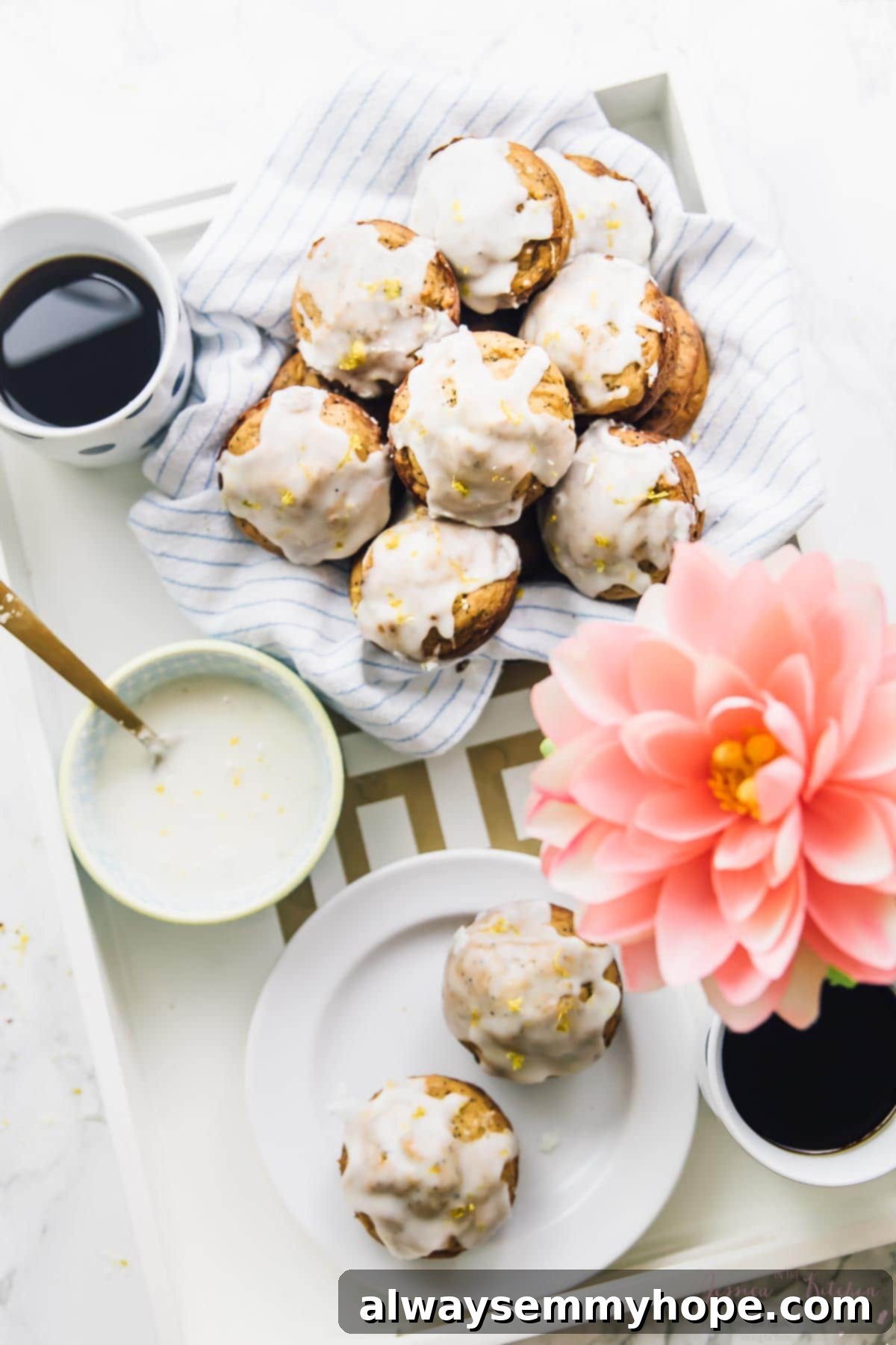 Golden lemon poppyseed muffins, topped with a delicate lemon glaze.