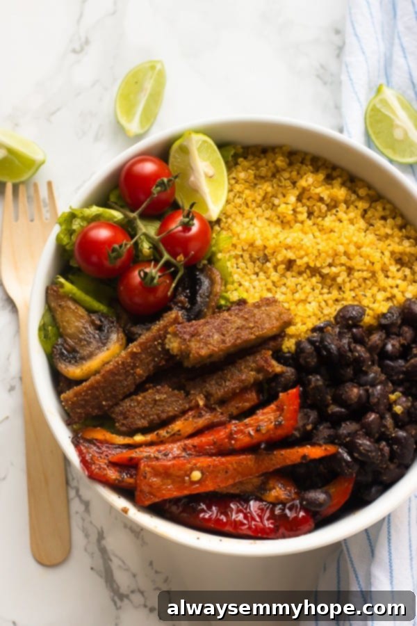 A bowl of veggies, seitan and quinoa. 
