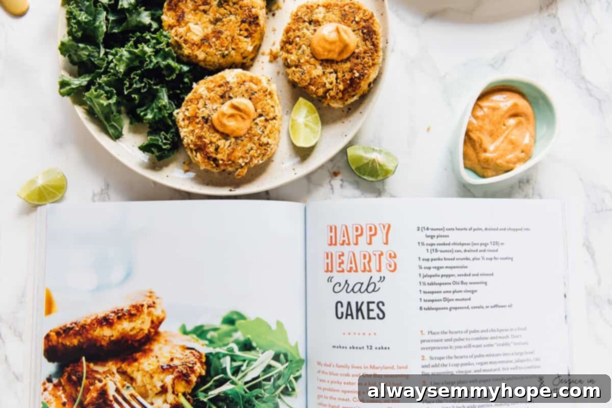 Top down view vegan crab cakes next to an open cook book.
