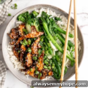 Bowl of rice with sticky sesame shiitake mushrooms, veggies, and chopsticks