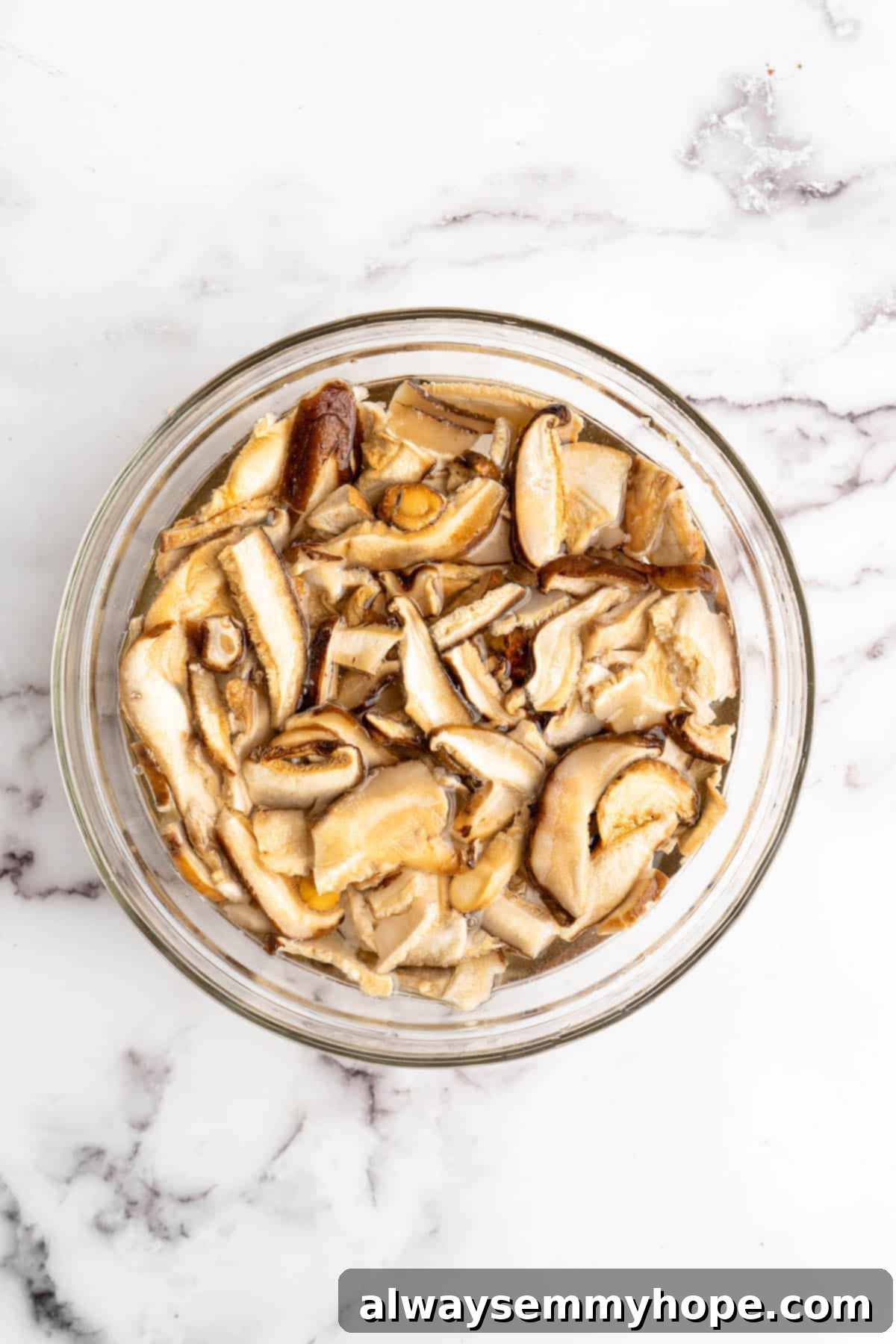 Overhead view of shiitakes being reconstituted in water