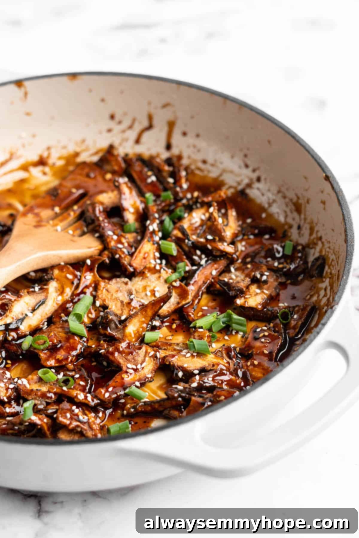 Sticky sesame shiitake mushrooms in enamel pan