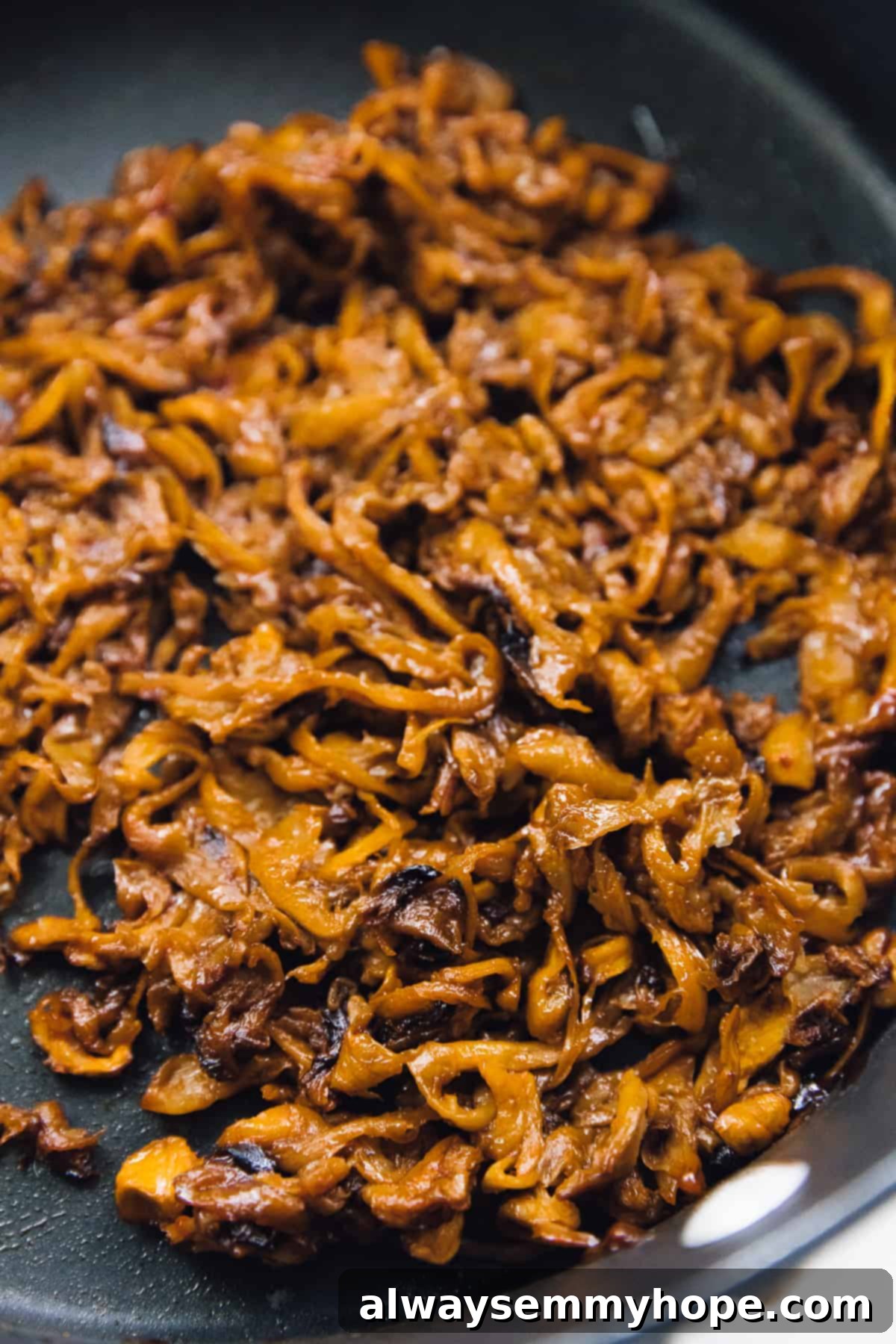 Smoky Vegan Pulled Mushroom Sandwiches 3 pulled mushrooms laid out cooking