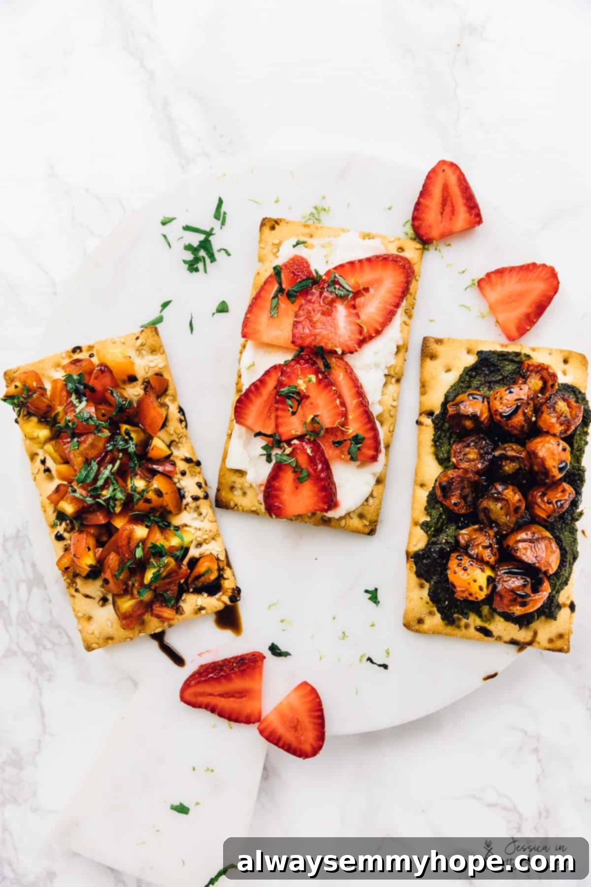 3 Quick and Easy Summer Appetizers With Video 2 Three crispbreads topped with colorful vegetables and fruits, arranged neatly on a white surface, ready to be served as appetizers.