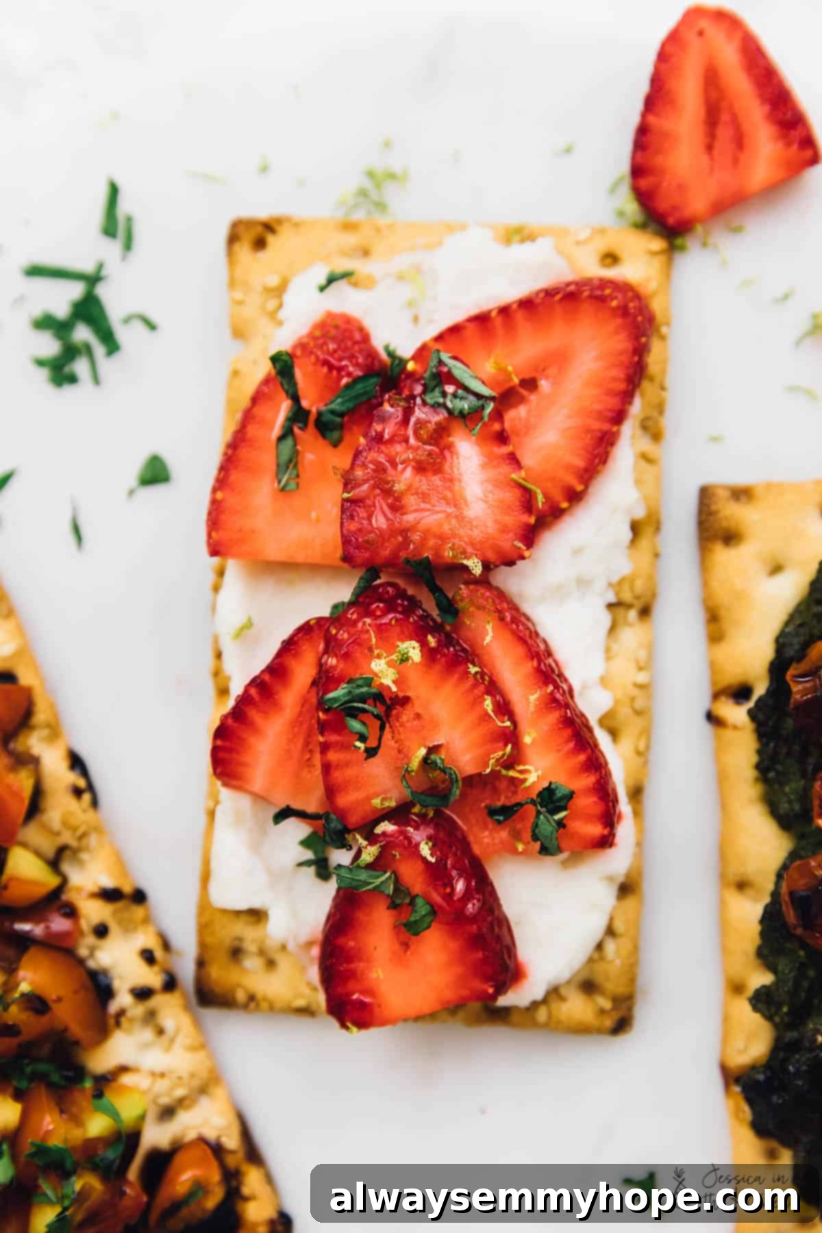 3 Quick and Easy Summer Appetizers With Video 7 Overhead view of a crispbread adorned with freshly chopped red strawberries, mint leaves, and a drizzle of sweet dressing.