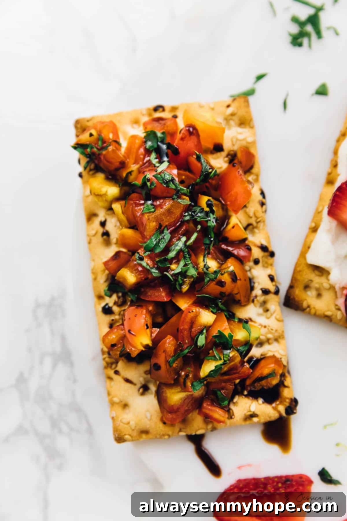 3 Quick and Easy Summer Appetizers With Video 8 Top-down view of a crispbread topped with classic bruschetta mixture: diced tomatoes, fresh basil, and a drizzle of balsamic glaze.