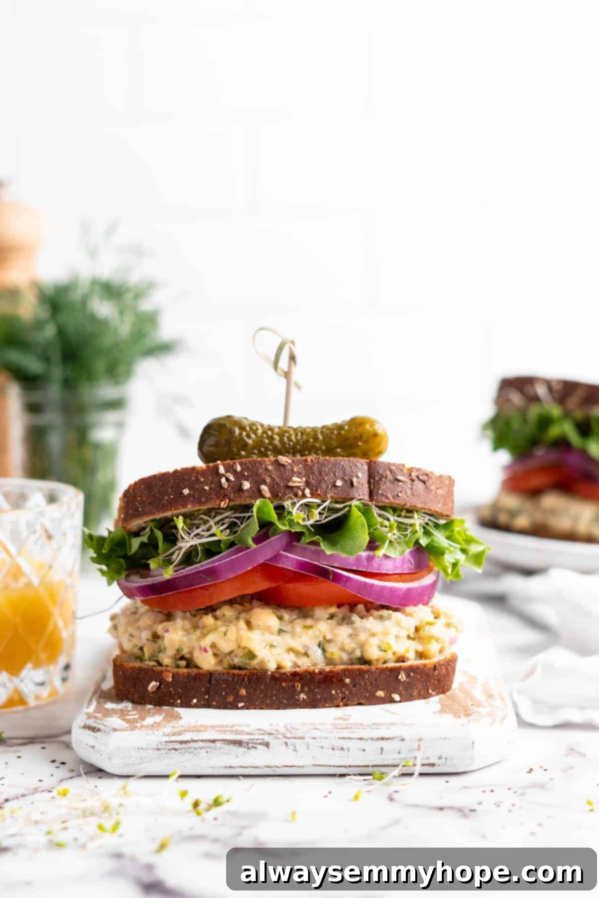 Creamy Vegan Chickpea Tuna Salad 2 Vegan chickpea tuna sandwich on cutting board