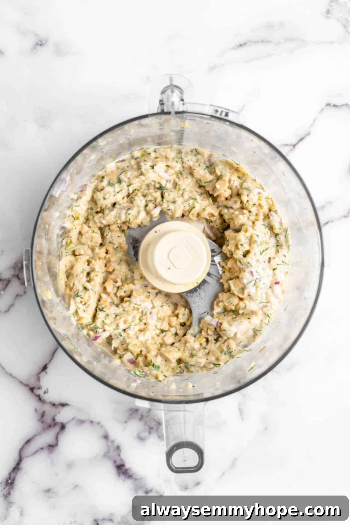 Creamy Vegan Chickpea Tuna Salad 5 Overhead view of vegan chickpea tuna salad in food processor bowl