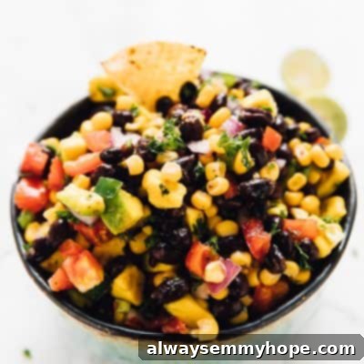 Southwestern Black Bean and Corn Delight 2 A bowl of chilled black bean and corn salsa with spicy jalapeños and creamy avocado.