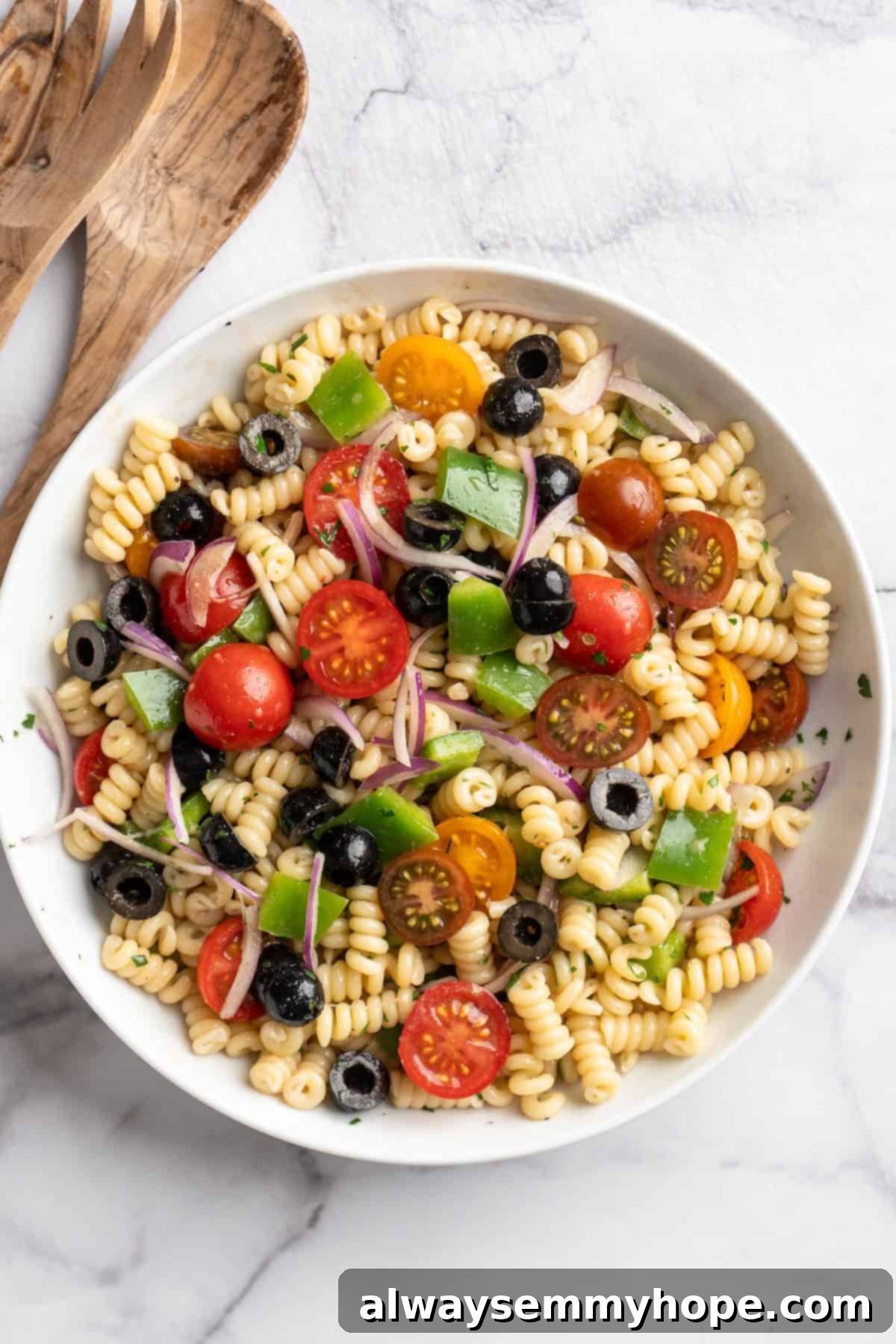 Enjoy your quick vegan pasta salad! Overhead view of a beautifully presented 15-minute vegan pasta salad in a white serving bowl, ready to be enjoyed.