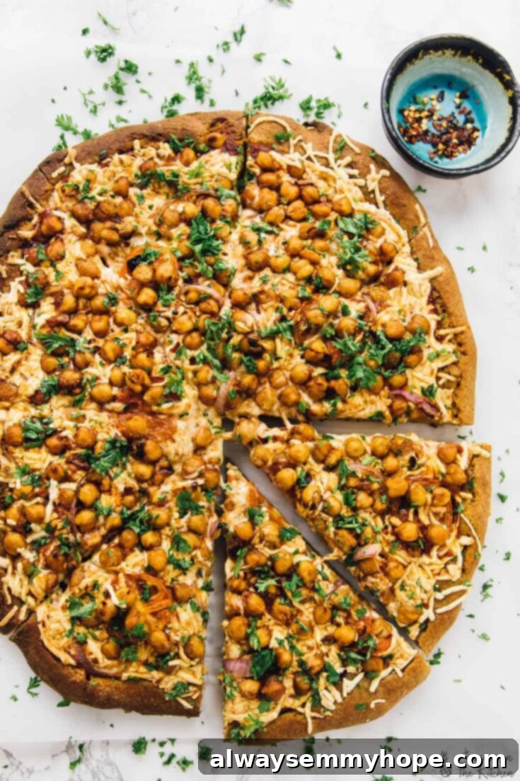 10 Irresistible Vegan BBQ Recipes for Grilling Season 5 A visually stunning Vegan Spicy BBQ Chickpea Pizza, generously topped with tangy BBQ sauce, melted vegan mozzarella cheese, and tender chickpeas, baked to perfection.