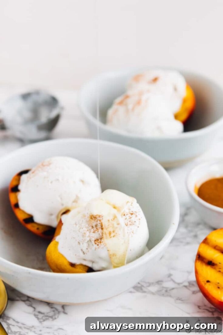 10 Irresistible Vegan BBQ Recipes for Grilling Season 6 Perfectly grilled peach halves, showing beautiful char marks and glistening with natural juices, served with scoops of creamy coconut ice cream.
