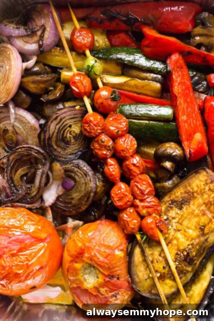 10 Irresistible Vegan BBQ Recipes for Grilling Season 8 A colorful medley of Balsamic Grilled Vegetables, including zucchini, eggplant, mushrooms, bell peppers, onions, and cherry tomatoes, showing delicious grill marks.