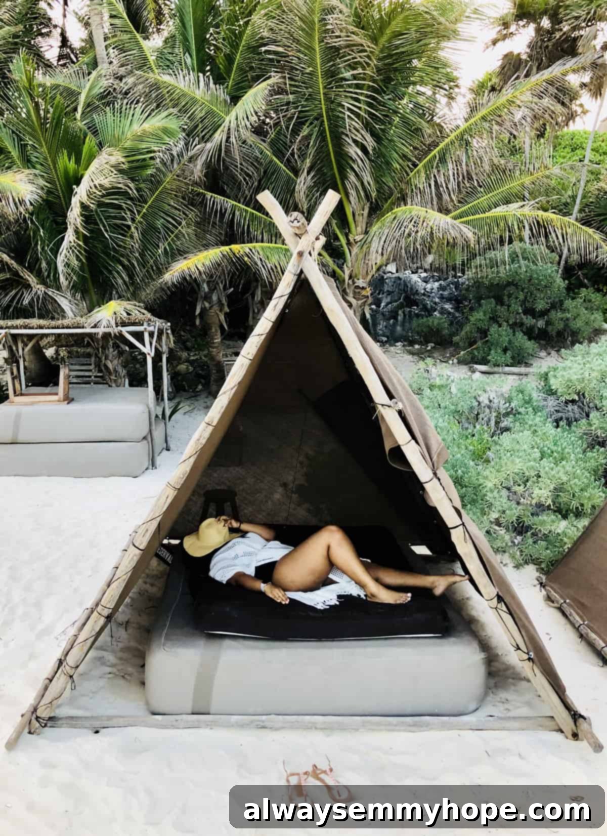 Jessica asleep, peacefully resting in a rustic beach hut hammock.