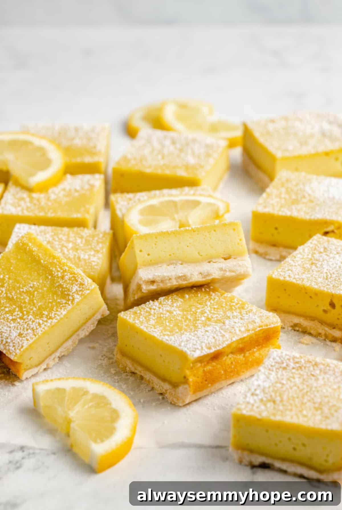 Sliced vegan lemon bars with halved fresh lemon slices, showcasing their vibrant yellow filling and golden crust.