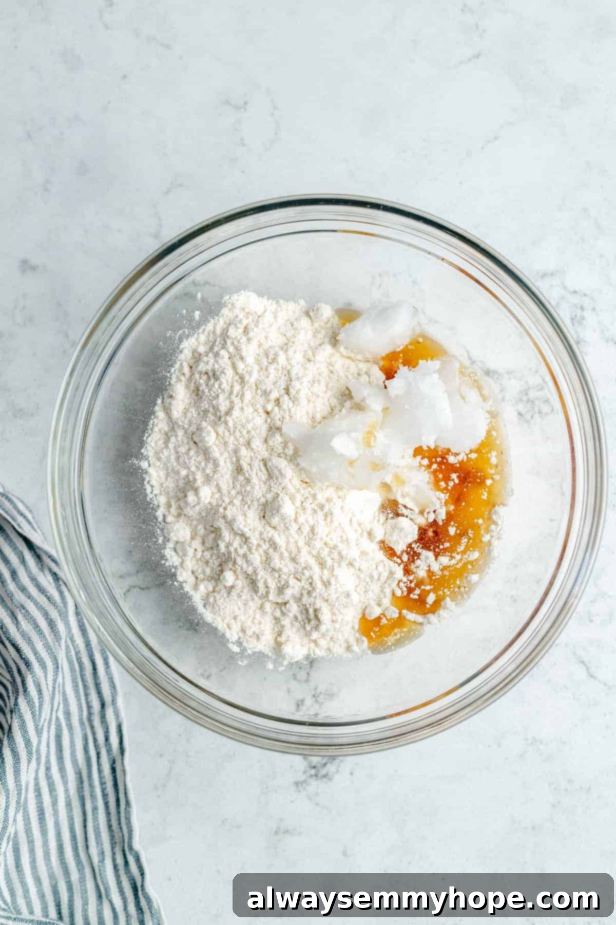Ingredients for homemade shortbread crust in a mixing bowl, ready to be combined.