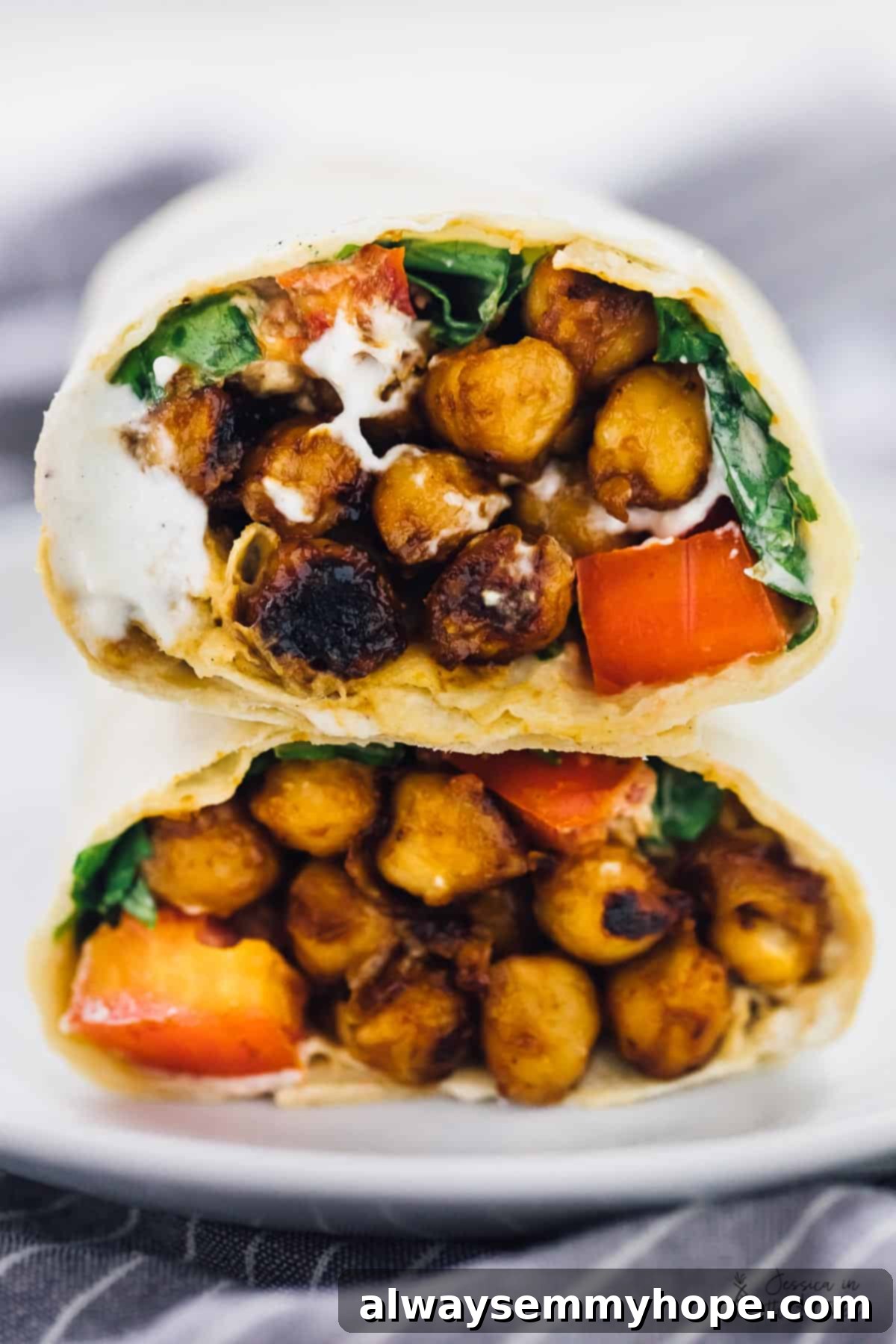 Smoky BBQ Chickpea Wraps with Creamy Ranch 2 Close up of bbq chickpea wrap cut in half.