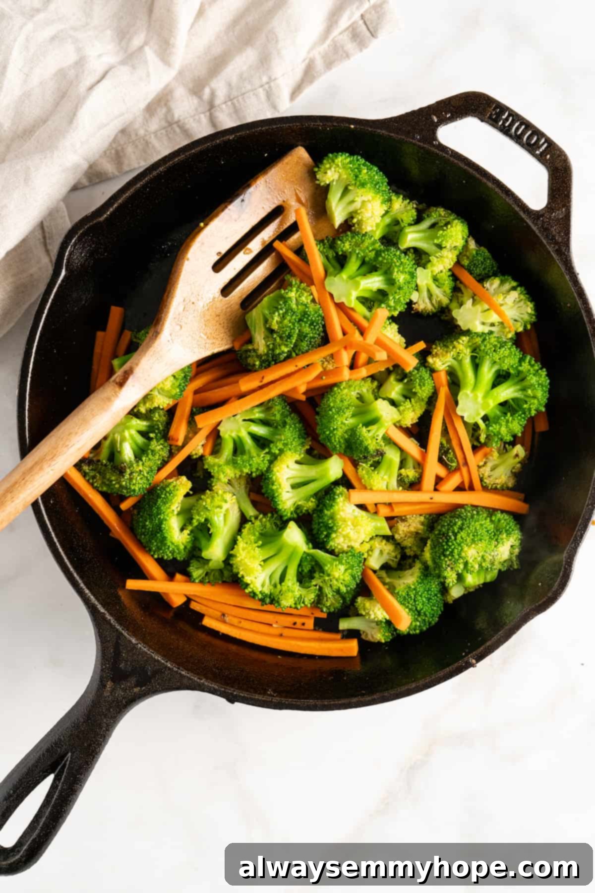 Glazed Ginger Tofu Stir-Fry 6 Overhead view of carrots and broccoli in cast iron skillet
