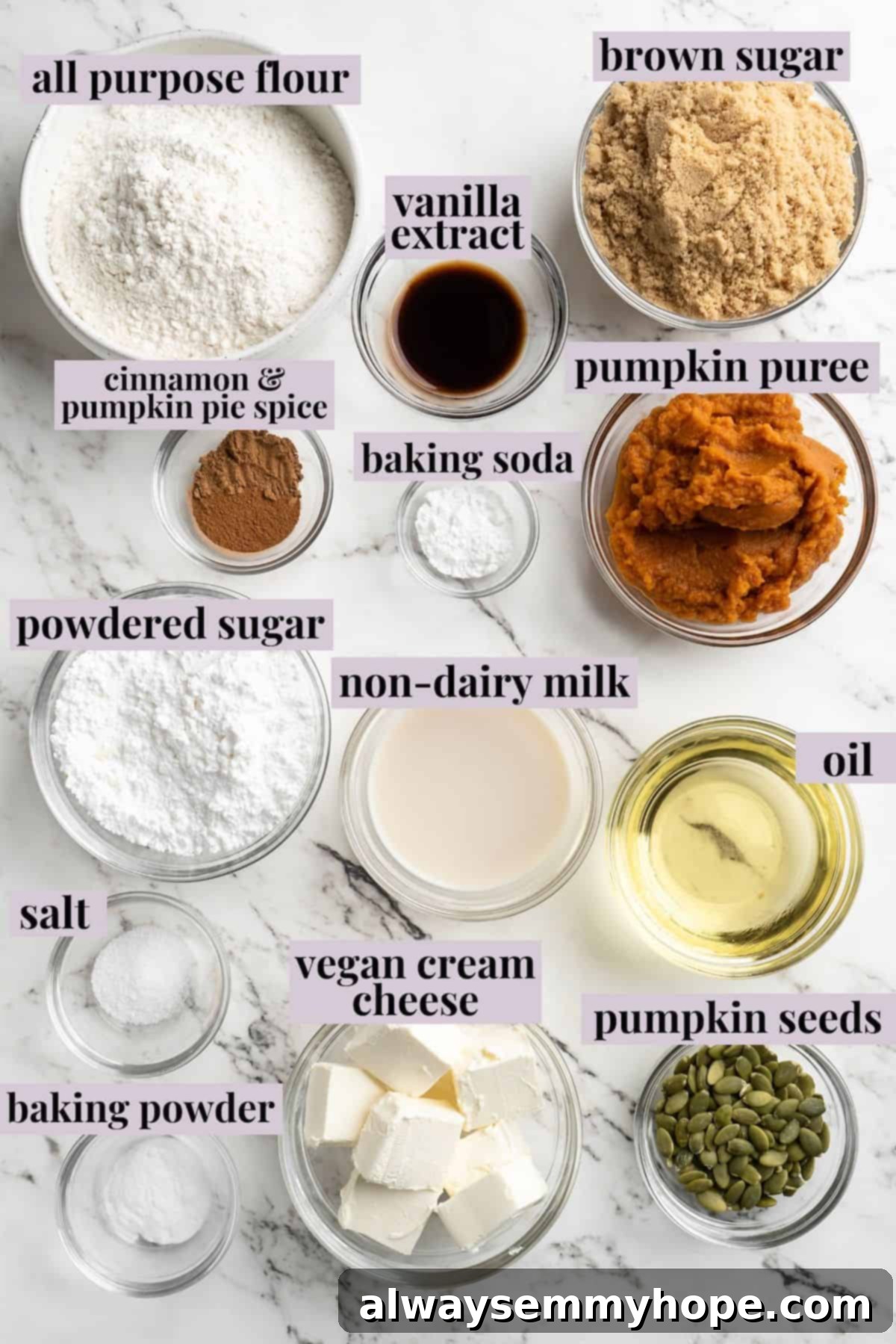 These vegan pumpkin cream cheese muffins pair the cozy flavour of pumpkin with a sweet-and-tangy cream cheese filling with delicious results! Overhead view of all ingredients for vegan pumpkin cream cheese muffins laid out with labels.