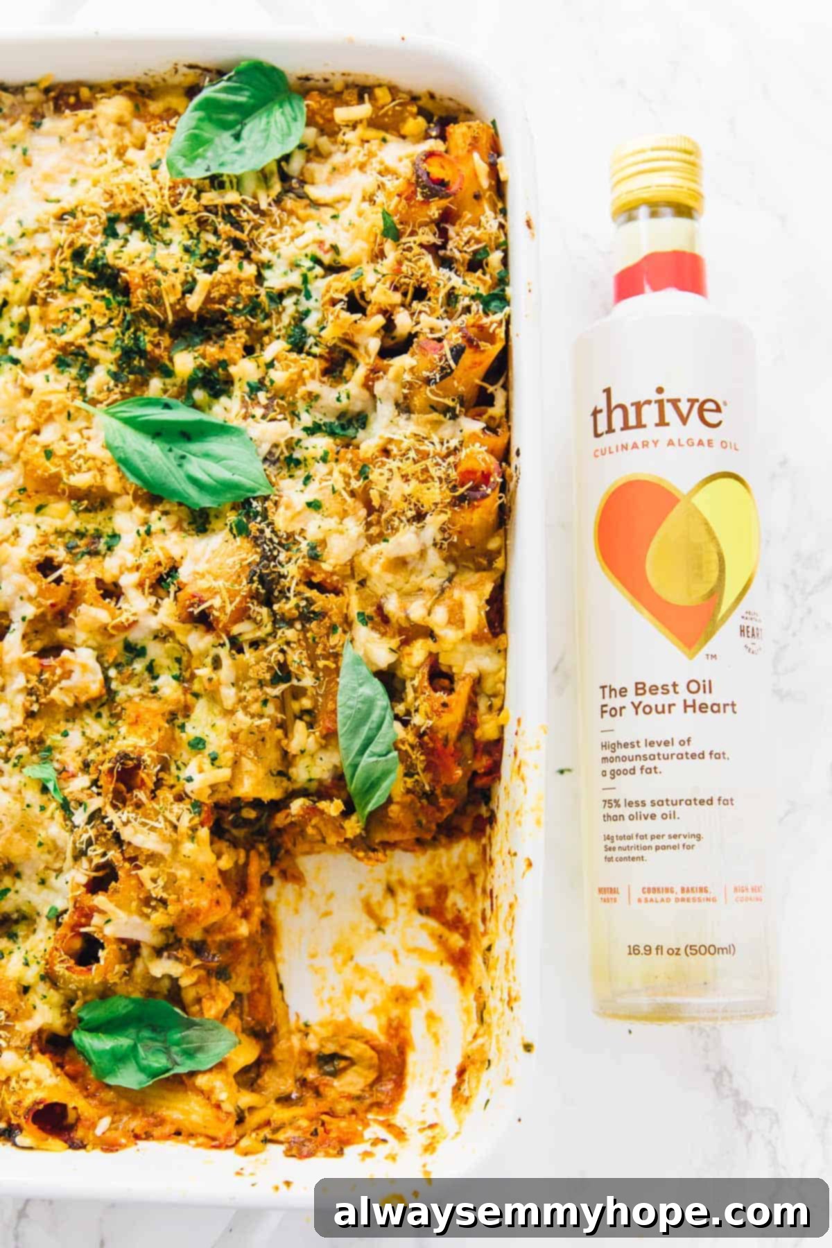 Creamy Vegan Cheese Pasta Bake 5 Vegan cheese pasta bake next to a bottle of algae oil.