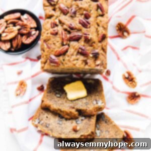Overhead view of moist and delectable banana bread, sliced, on a table.