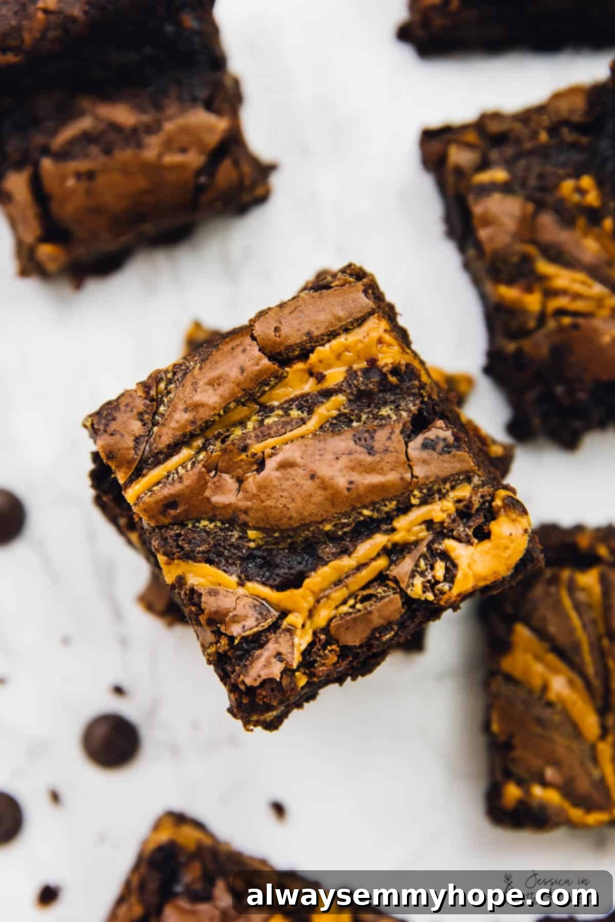 Overhead view of vegan brownies, stacked on a table. 