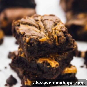 A stack of vegan brownies on a white table top.