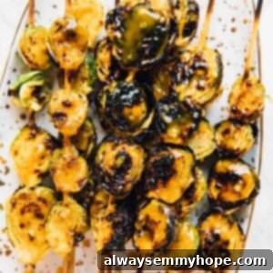 Overhead shot of grilled on skewers. maple mustard brussels sprouts.