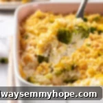 Serving spoon lifting portion of broccoli cheese rice casserole from dish