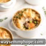 Vegan pot pies in white ramekins, center pie with filling visible