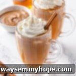 Two glass mugs of vegan hot buttered rum