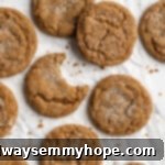 Overhead view of gingersnap molasses cookies on crumpled parchment