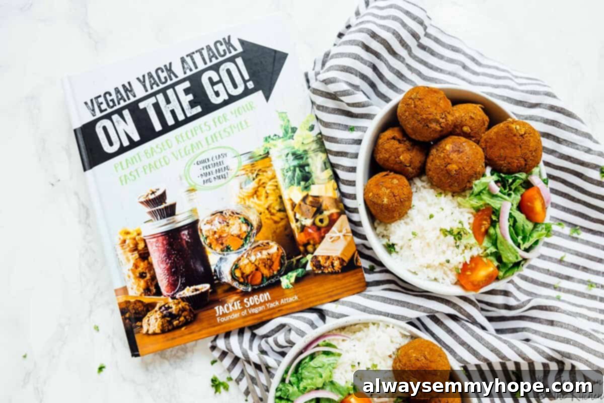 Two vibrant bowls of vegan lentil balls and zesty rice, positioned next to the 'Vegan Yack Attack On The Go!' cookbook.