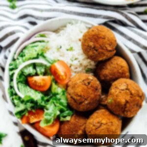 A bowl of lentil balls with salad, a refreshing vegan meal.