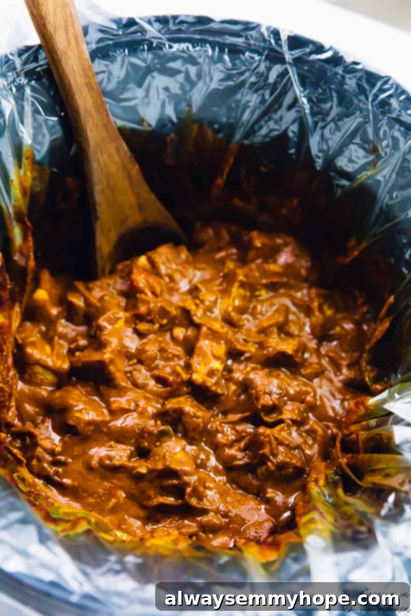 Slow Cooker Vegan Tofu Butter Chicken 3 Tofu butter chicken simmering perfectly in a slow cooker, showcasing the rich sauce and tender tofu pieces.