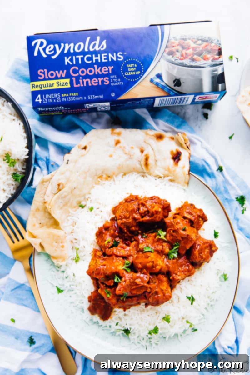 Slow Cooker Vegan Tofu Butter Chicken 4 A plate of Slow Cooker Tofu Butter Chicken with rice and naan, next to a pack of Reynolds Kitchens Slow Cooker Liners, emphasizing convenience.