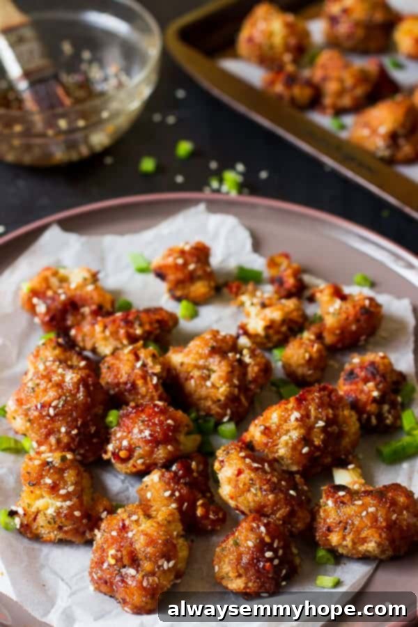Sticky cauliflower wings on a parchment paper.