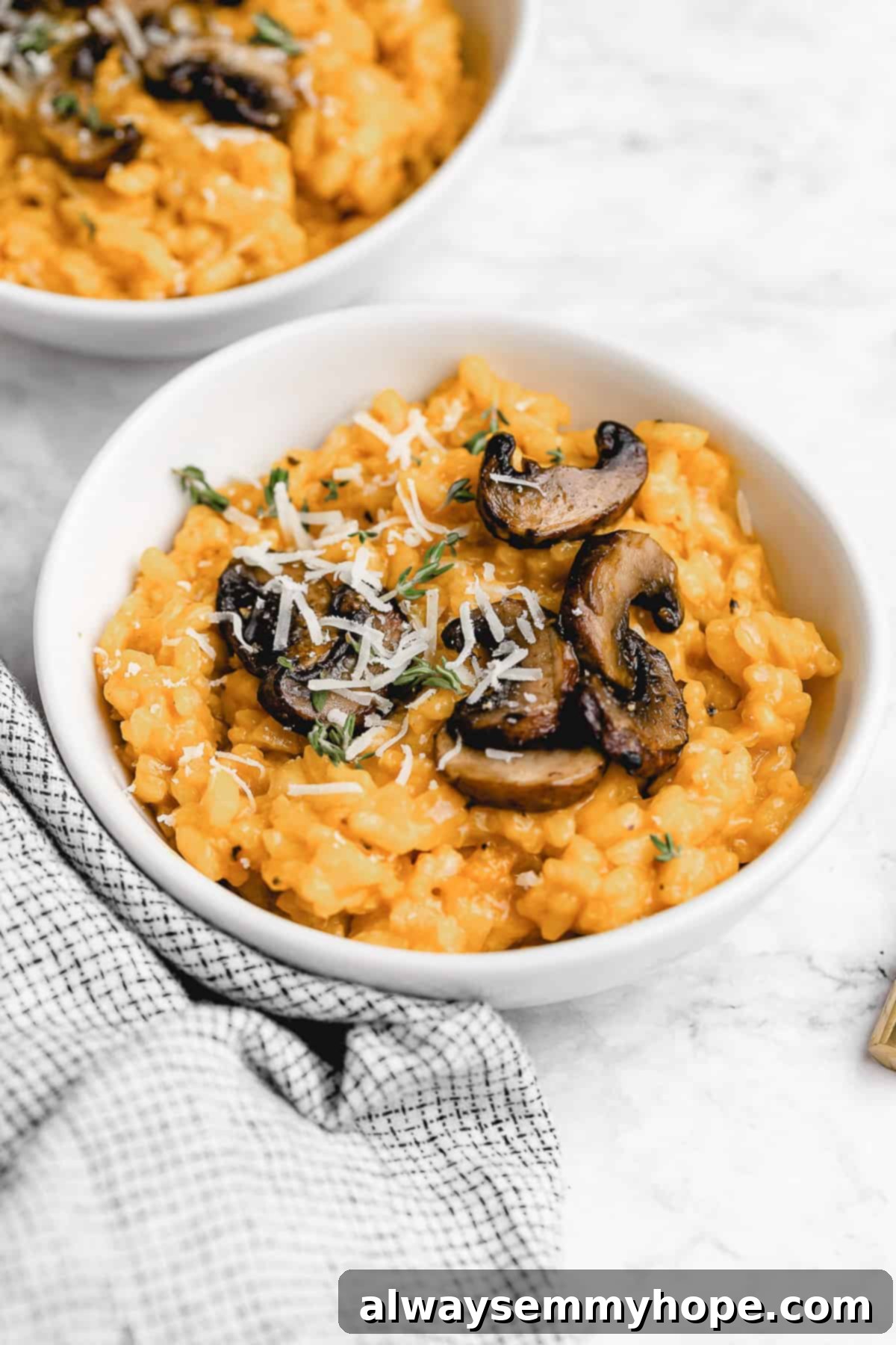 Vegan mushroom risotto with vegan parmesan cheese.