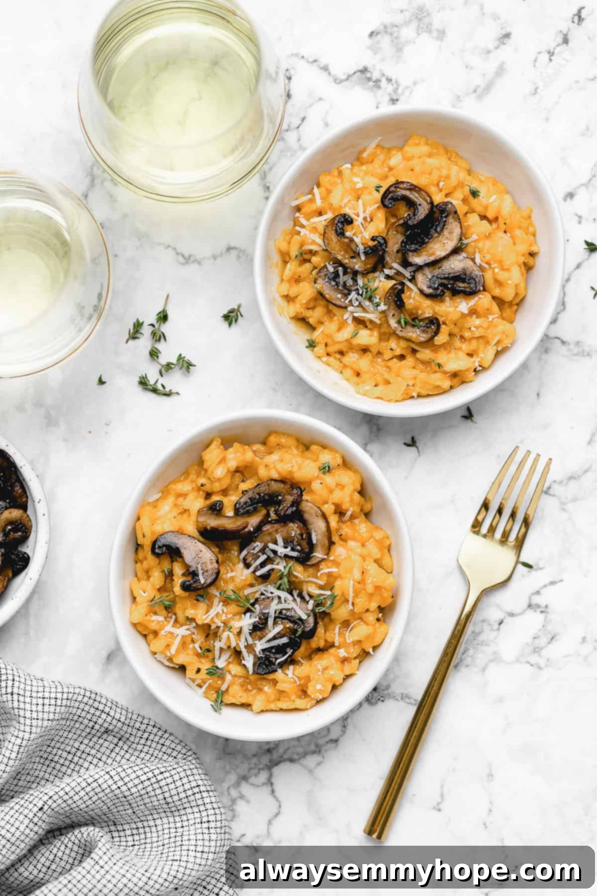 Two bowls of mushroom risotto.