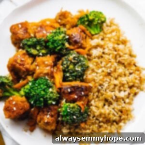 Zesty Peanut Ginger Tempeh Stir Fry 7 Tempeh stir fry on a white plate.